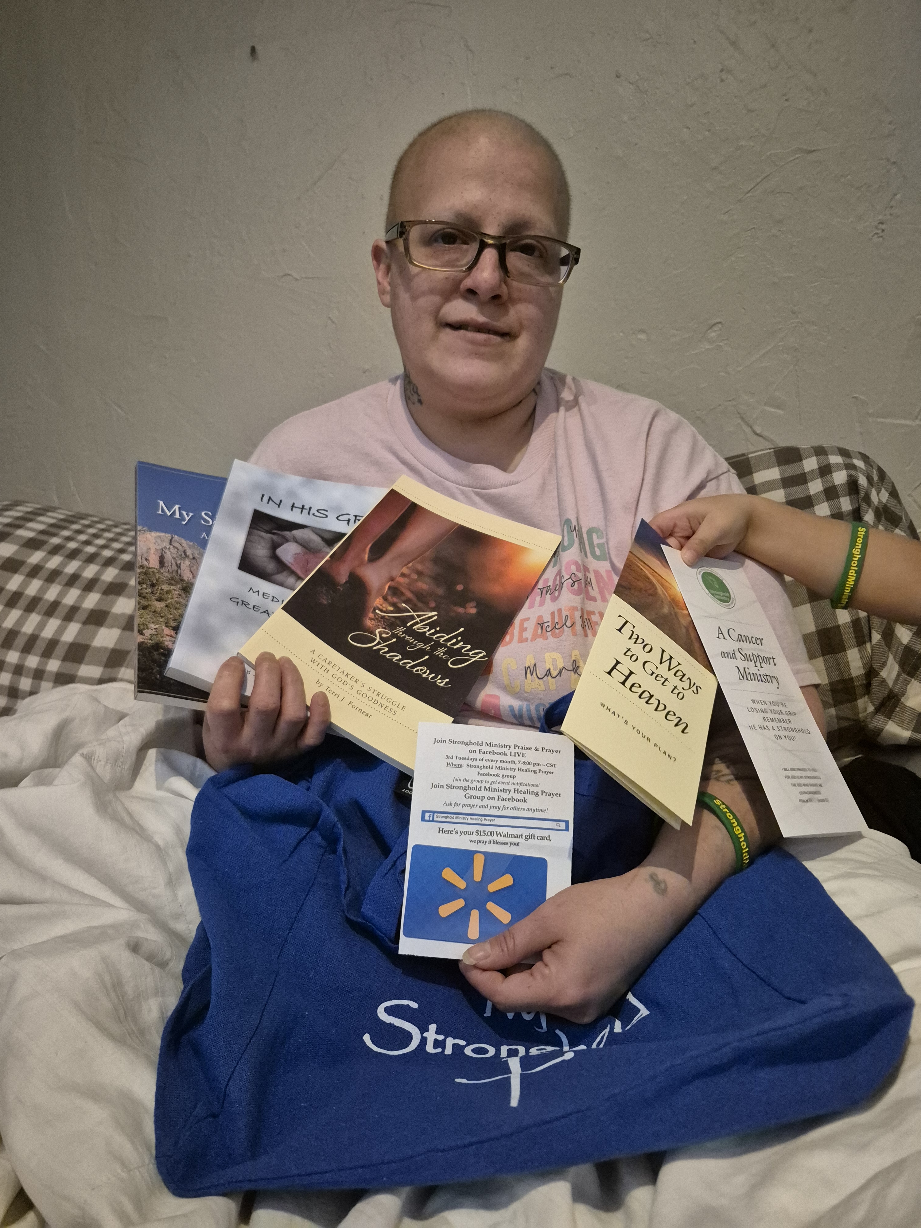 Female Cancer Patient Holding Stronghold Ministry Gift Basket Contents