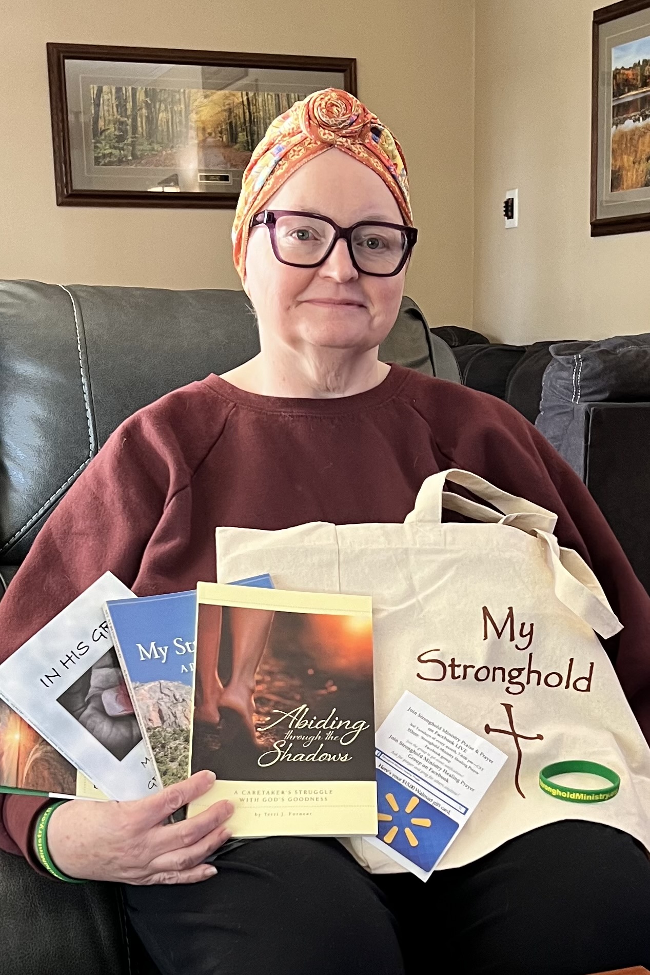 Female Cancer Patient Holding Stronghold Ministry Gift Basket Contents